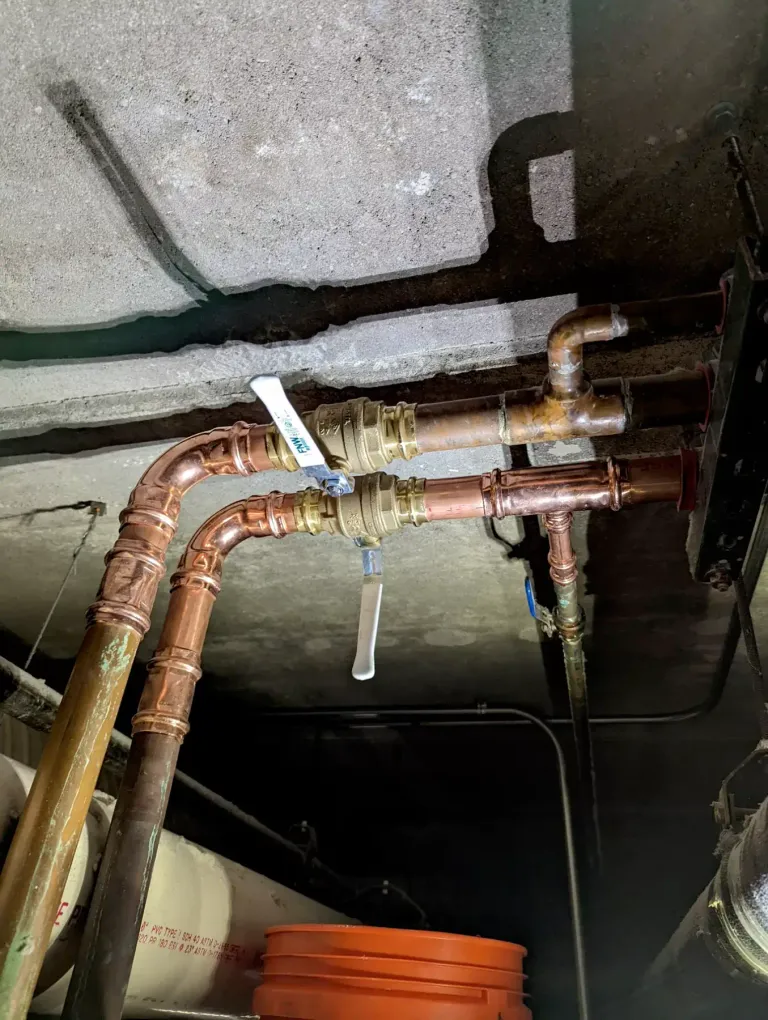 Two-inch press shut-off valves on copper pipe.