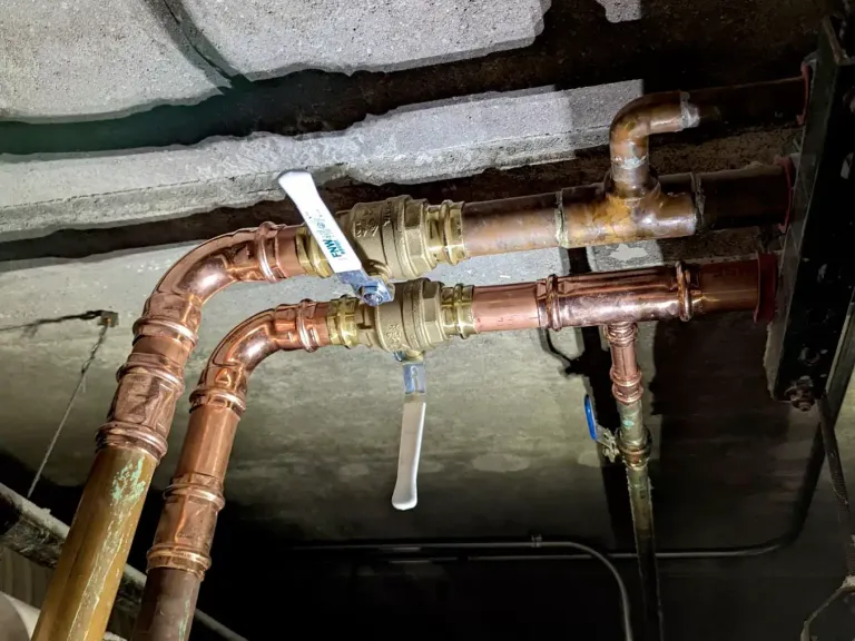 Two-inch press shut-off valves on copper pipe.