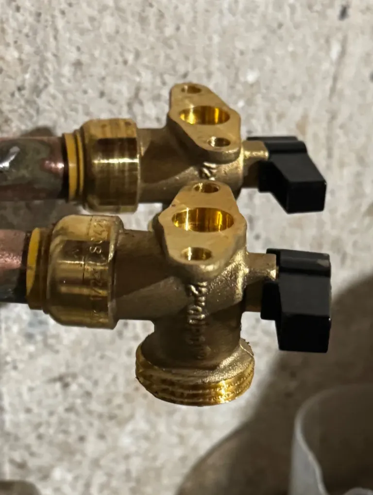 Brass nozzles laid out on a work surface.