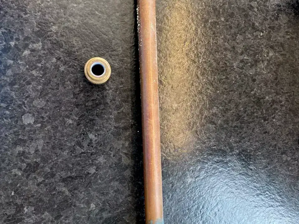 Outdoor faucet assembly with a split copper stem from freezing.