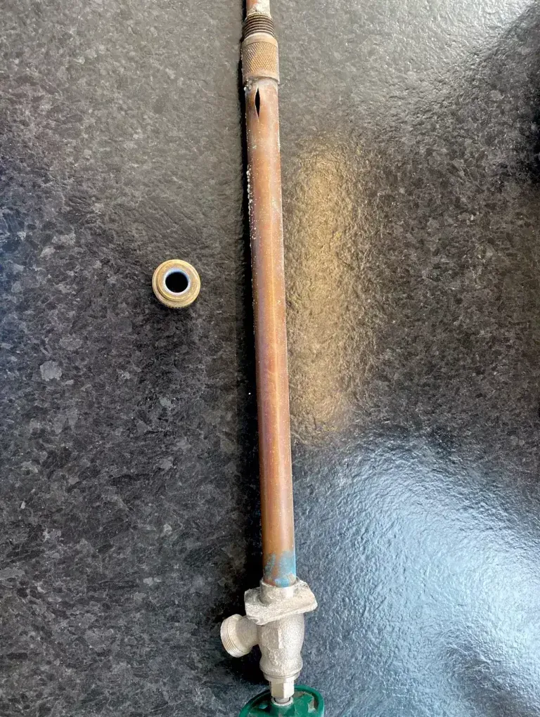 Outdoor faucet assembly with a split copper stem from freezing.