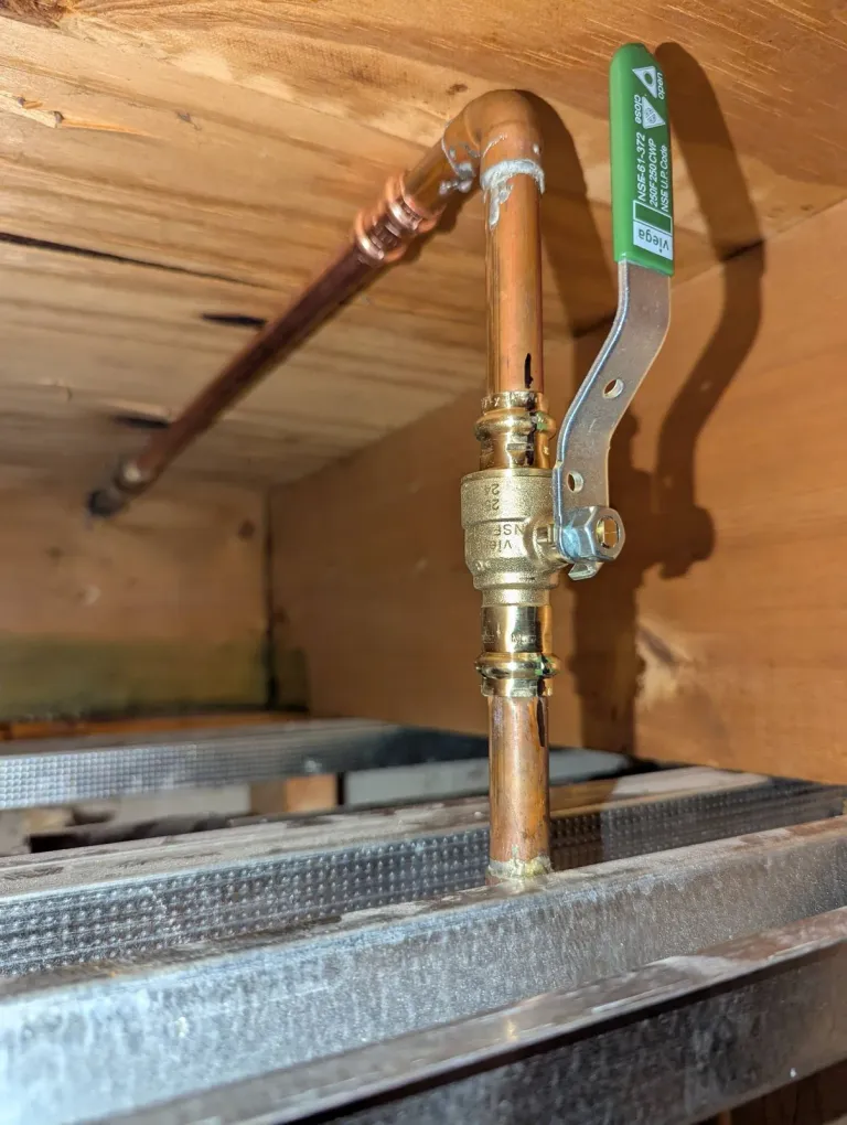 Copper pipe joined with a press ball valve.