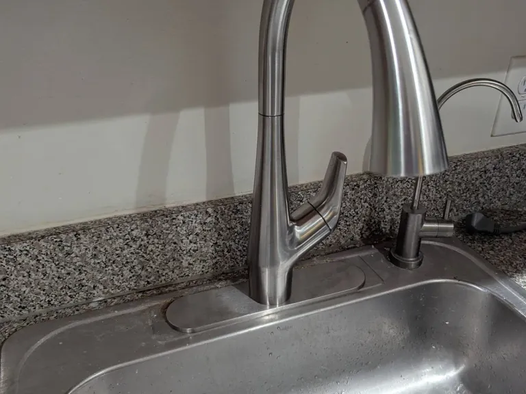Chrome kitchen faucet.
