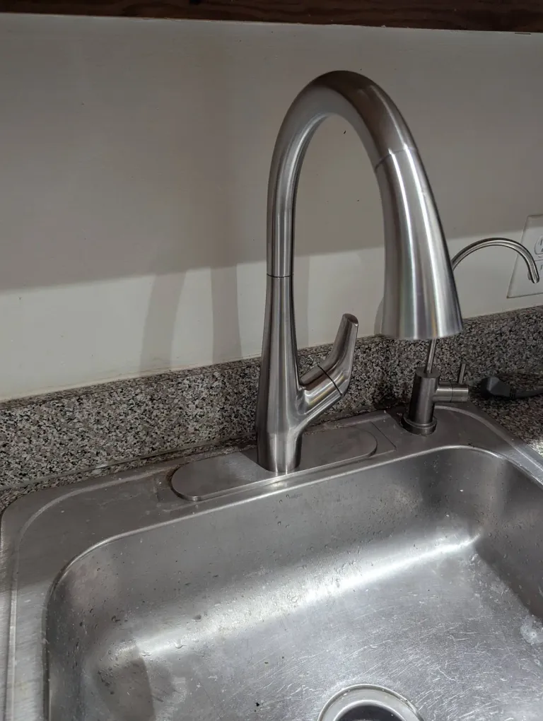 Chrome kitchen faucet.