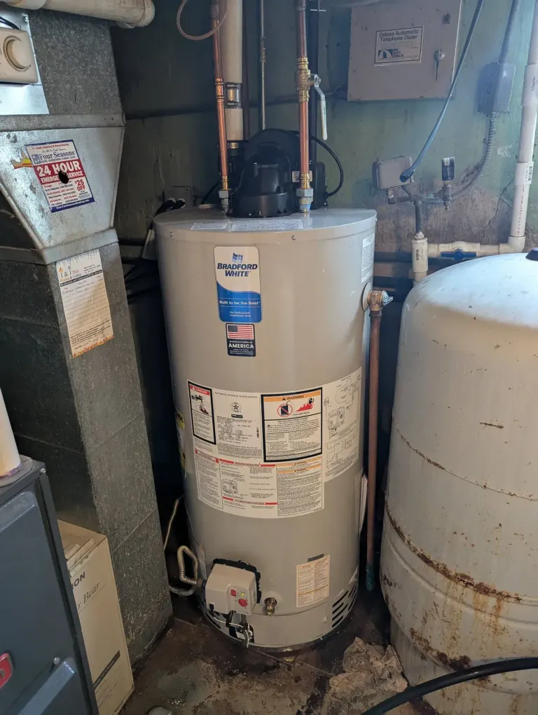 A water heater in a basement.